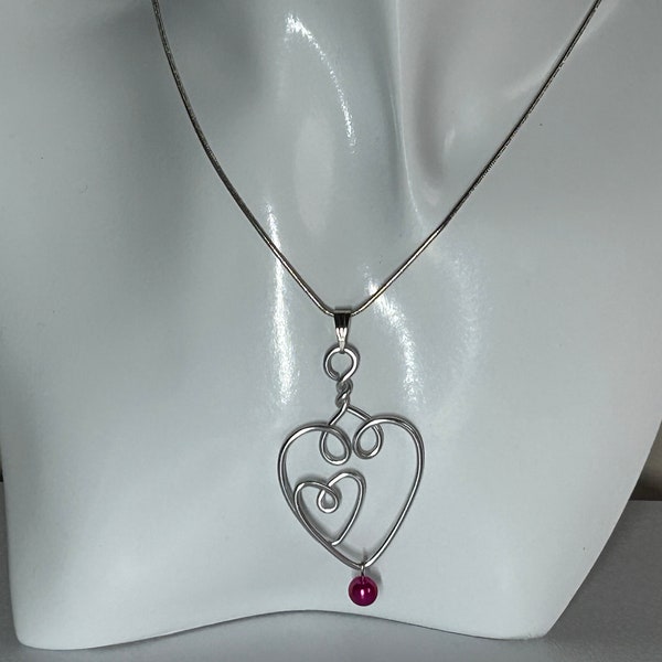 Entwined hearts necklace