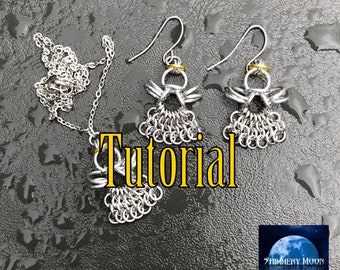 May include: A silver-colored chainmail angel necklace and earrings set. The earrings and pendant feature an angel design with a halo and chainmail skirt. The word "Tutorial" is displayed in yellow text.