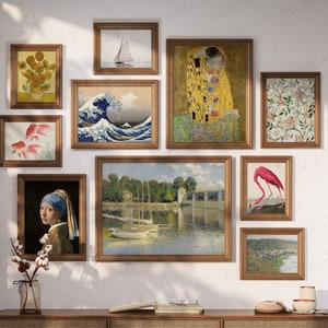 May include: A collection of framed artwork on a white wall. The artwork includes a painting of a wave, a painting of a couple kissing, a painting of a flamingo, a painting of sunflowers, a painting of fish, a painting of a boat, and a painting of a floral pattern.