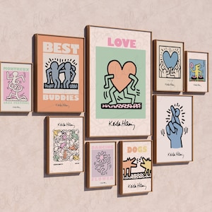 May include: A collection of eight framed prints featuring colorful illustrations by Keith Haring. The prints depict various themes, including love, best buddies, dancing, dogs, and a flower. Each print has a white background with black outlines and vibrant colors.