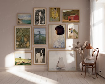 May include: A wall gallery featuring a variety of framed artwork, including a peacock, a sailboat, a woman with long hair, a landscape with a red house, and a woman with short hair. The artwork is arranged in a grid pattern on a light beige wall.
