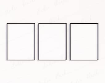 May include: Three black picture frames with white mats are hanging on a white wall. The frames are arranged in a row, with the leftmost frame slightly higher than the other two.