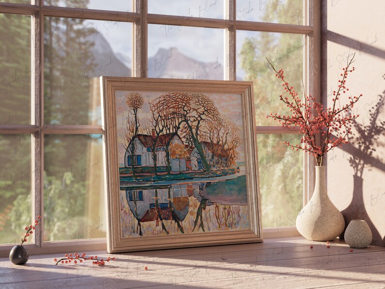 May include: A framed painting of a house with trees and a reflection in the water. The painting is in a light wood frame and is hanging on a wall. There are red berries in a vase on the windowsill.