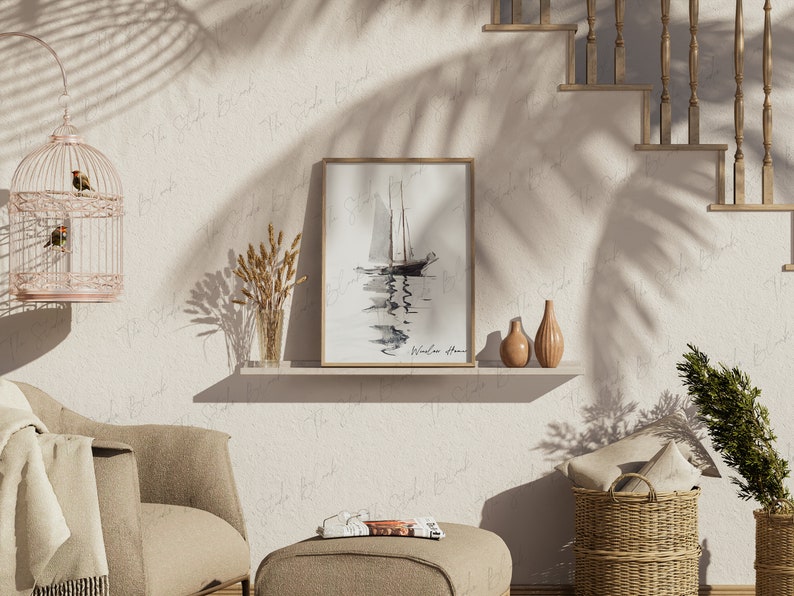 May include: A framed black and white watercolor painting of a sailboat on the water with the text "Windless Home" at the bottom. The painting is on a white shelf with two decorative vases and a vase with dried wheat.