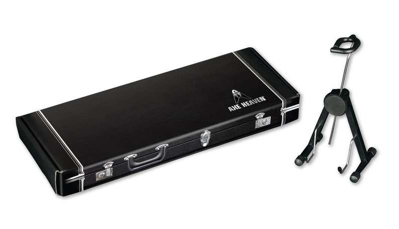 May include: Black guitar case with the text "Axe Heaven" on the top. A black guitar stand is also pictured.