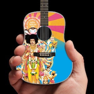 May include: A small acoustic guitar with a colorful design featuring a psychedelic image of Jimi Hendrix and the text "Are you experienced?"  The guitar is blue, pink, yellow, and orange.