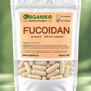 May include: A white resealable pouch containing 240 off-white capsules of Organiko Fucoidan premium supplements. The label features the brand name, 500 mg per capsule dosage, ingredient list, suggested use, and website address in black text.