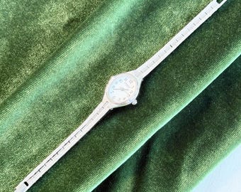 Vintage Caravelle by Bulova Ladies Watch, White Dial Oval Case, Slim Silver Bracelet, Classic Dress Watch, Gift for Her