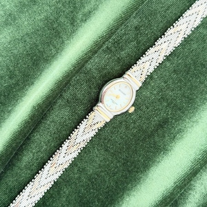 Women's Vintage 90s Dainty Two Tone Oval Quartz Watch with Intricate Woven Link Bracelet Sharp