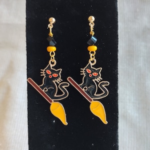 Charming Halloween Black Cat on Witch&#39;s Broom Earrings. Halloween jewelry. Unique Halloween earring. Teen or best friend gift. Cat earring.