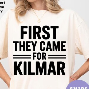 May include: Ivory t-shirt with black text that reads "First they came for Kilmar"