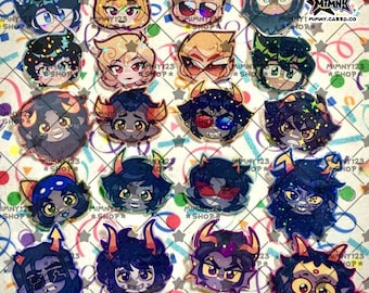 May include: A collection of colorful, cartoon-style character stickers. Each sticker features a unique face with various hair colors, horns, and accessories. The stickers are arranged on a patterned background with the text "MIMNY123 SHOP" and "PRODUCT INDEPENDENTLY MADE BY: MIMNK".