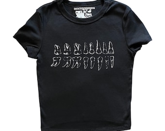 teeth  baby tee. (women’s tight fitting crop top)