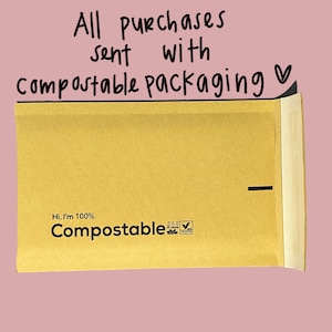 May include: A brown paper envelope with the text "Hi, I'm 100% Compostable" and a compostable logo. The envelope is sealed with a black line.