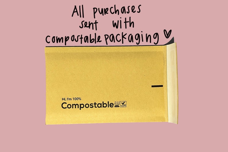 May include: A brown paper envelope with the text "Hi, I'm 100% Compostable" and a compostable logo. The envelope is sealed with a black line.