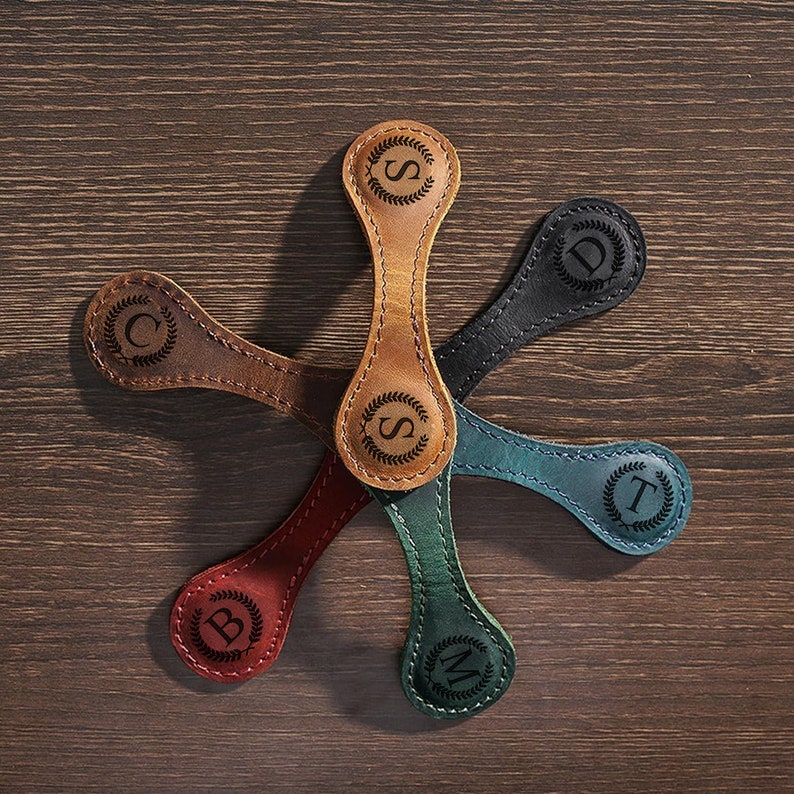 Personalize this bookmark with a monogram for book lovers, making it a unique gift.