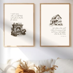 Puede incluir: Dos impresiones artísticas enmarcadas con una paleta de colores neutros. Una presenta una ilustración de chimenea con texto, y la otra una casa con texto. Se exhiben sobre un sofá blanco con cojines decorativos.