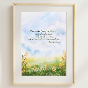 May include: A framed watercolour print with the quote: "God spoke today in flowers, and I, who was waiting on words, almost missed the conversation." The artwork shows a field of flowers beneath a blue sky with clouds.