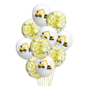 May include: A bunch of white and clear balloons with yellow confetti and a yellow construction truck design. The balloons are tied together with a string.