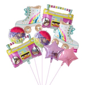 May include: A set of 7 colorful foil balloons featuring a boombox, roller skates, and "Happy Birthday" text. The balloons are tied together with strings.