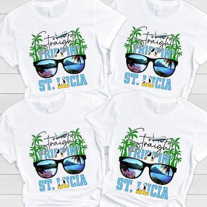 May include: Four white t-shirts with a graphic design of sunglasses with palm trees and the text "Straight Trippin' ST. LUCIA".