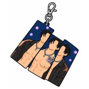 May include: A rectangular acrylic keychain featuring a stylized illustration of three figures with dark hair, wearing silver chain necklaces and open black jackets. The background is dark blue with purple circular accents, and a silver lobster clasp is attached.