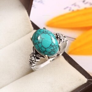 Handmade Turquoise Sterling Silver Ring: Oval Prong Set, Floral Band