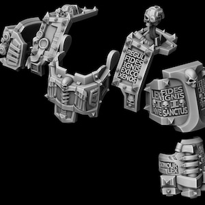 May include: Gray, detailed miniature armor pieces, possibly for a tabletop game or model kit. The components feature intricate designs, skulls, and text inscriptions. The pieces are arranged against a black background.