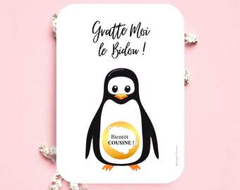May include: A white card with a black and white penguin illustration. The penguin has a gold circle on its belly with the text "Bientot Cousine!" inside. The card also has the text "Gratte Moi le Bidou!" in black.