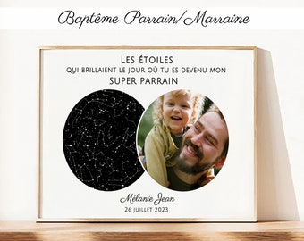 May include: A white framed print with a black and white star map and a photo of a child and an adult. The text reads "LES ÉTOILES QUI BRILLAIENT LE JOUR OÙ TU ES DEVENU MON SUPER PARRAIN Mélanie Jean 26 JUILLET 2023".