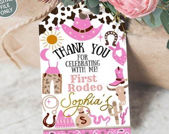 May include: Pink and brown printable favor tag with a cow print background. The tag features a pink cowboy hat, a horseshoe, a cactus, a snake, and the text "Thank You for Celebrating with Me! First Rodeo Sophia's".