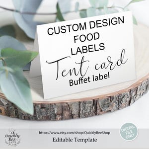 May include: A white tent card with black text that reads "CUSTOM DESIGN FOOD LABELS Tent card Buffet label." The card is on a wooden slice with greenery in the background. The bottom of the card has the text "Editable Template."