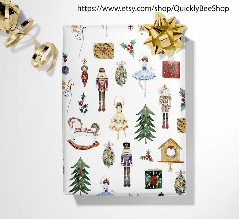 May include: White wrapping paper with a repeating pattern of watercolor illustrations of a nutcracker, a ballerina, a rocking horse, a Christmas tree, a birdhouse, and a Christmas wreath. The illustrations are in shades of red, green, blue, gold, and brown.