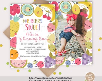 May include: A colorful fruit-themed birthday invitation with a photo of a young girl. The invitation says "Our Berry Sweet Olivia is turning One" and includes details for the party, including the date, time, and location. The invitation is decorated with a variety of fruits, including strawberries, cherries, lemons, and watermelons.
