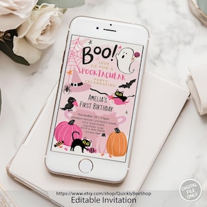 May include: A pink and black digital invitation for a first birthday party with the text "Boo! Join us for a Spooktacular Party Celebrating Amelia's First Birthday". The invitation features a ghost, bats, a witch's hat, and pumpkins.
