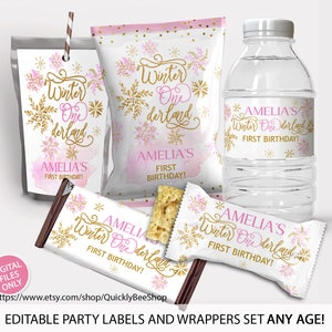 May include: Party favor labels and wrappers set for a first birthday. The design features a winter wonderland theme with pink watercolor accents, gold snowflakes, and the text "Winter One derland" and "Amelia's First Birthday!"