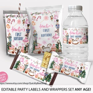 May include: A collection of party labels and wrappers with a festive design. The labels feature the text "Amelia's First Birthday" with illustrations of nutcrackers, ballerinas, and holiday decorations. Includes a water bottle, candy bar, and snack bag.