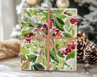 May include: A wrapped gift box featuring a watercolor design of green leaves and red berries on a white background. The box is tied with a copper-colored ribbon. The Etsy shop URL is visible at the bottom.