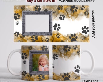 May include: Two white ceramic mugs with a design of black paw prints on a watercolor background. The mugs are 11 ounces and 15 ounces. The design also includes a wood-framed photo insert.