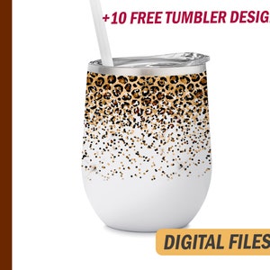 May include: A white 12 oz wine tumbler with a leopard print and gold glitter design. The tumbler has a lid and a straw.  +10 FREE TUMBLER DESIGNS. DIGITAL FILES