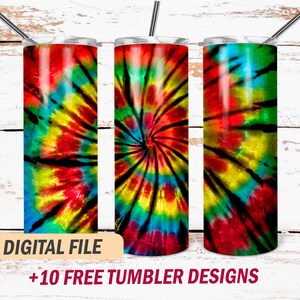 May include: Three stainless steel tumblers with a tie-dye design in shades of red, yellow, blue, green, and black. The tumblers are on a white wooden background. "DIGITAL FILE +10 FREE TUMBLER DESIGNS" is written in red and white text at the bottom of the image.