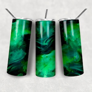 May include: Three cylindrical tumblers featuring a vibrant emerald green and black marbled pattern with swirling smoke-like effects. Each tumbler includes a clear lid and a thin, straight metallic straw extending from the top center opening.