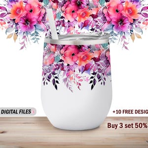 May include: White stainless steel tumbler with a floral design featuring pink, purple, and blue watercolor flowers. The tumbler has a straw and is sitting on a wooden surface.  +10 FREE DESIGNS Buy 3 set 50% off