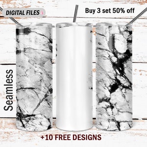 Puede incluir: Tres vasos de acero inoxidable con un diseño de mármol blanco. Los vasos tienen una capacidad de 20 oz y una pajita. El texto "Buy 3 set 50% off" está en la parte superior de la imagen. El texto "+10 FREE DESIGNS" está en la parte inferior de la imagen.