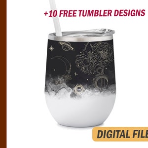 May include: A 12 oz wine tumbler with a black and white celestial design, featuring a moon, sun, and floral elements. The tumbler has a white base and a silver rim, with a straw and the text "+10 FREE TUMBLER DESIGNS". The words "DIGITAL FILES" are also visible.