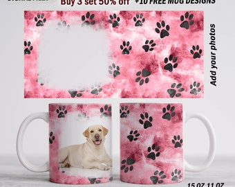 May include: Two white ceramic mugs with a pink and black paw print design. The mug on the left has a photo of a yellow Labrador Retriever dog. The mug on the right has the text "15 OZ 11 OZ".