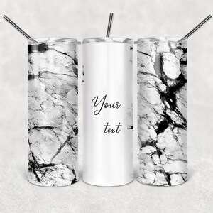 May include: Three cylindrical tumblers with metal straws. Two tumblers feature a black and white marble pattern, while the center tumbler is white with the black script text Your text. The tumblers have a smooth finish and a straight design.