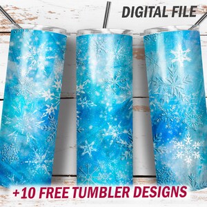 May include: Three cylindrical tumblers featuring a blue watercolor background with white snowflake patterns and a metallic straw. The text DIGITAL FILE and +10 FREE TUMBLER DESIGNS are printed on the image.