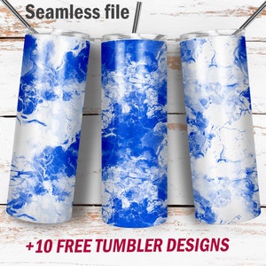 May include: Three stainless steel tumblers with a blue and white marbled design. The tumblers are hanging from a metal bar. The text "Seamless file" is at the top, and "+10 FREE TUMBLER DESIGNS" is at the bottom.