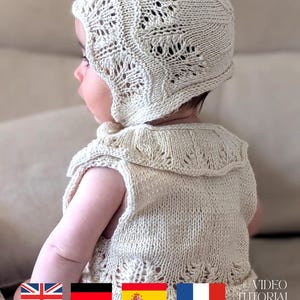 Può includere: Un completo per neonati in maglia color crema, composto da cappellino e vestito senza maniche. Il cappellino presenta un delicato motivo traforato, e il vestito ha scollatura e orlo smerlati. Il set è in filato morbido, per neonato.